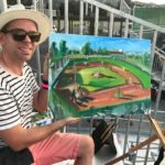 Artist paints Waterfront Park field during game Artist paints Waterfront Park field during game