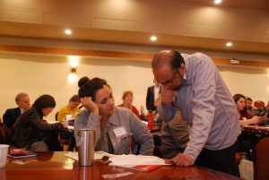 Vijay Balakrishnan, right, explains budgeting techniques to Alexa Senter at the Deluxe business semina