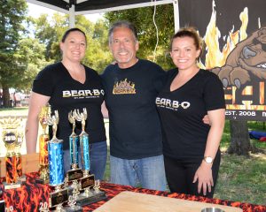 Steve Likos, owner of Bear•B•Q, and his daughters Nicole and Angela