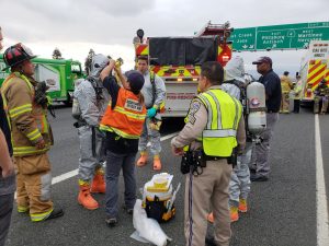 ConFire on scene of vehicle accident with chemical spill