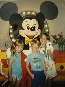 Vivian's three children with Mickey Mouse in 1988